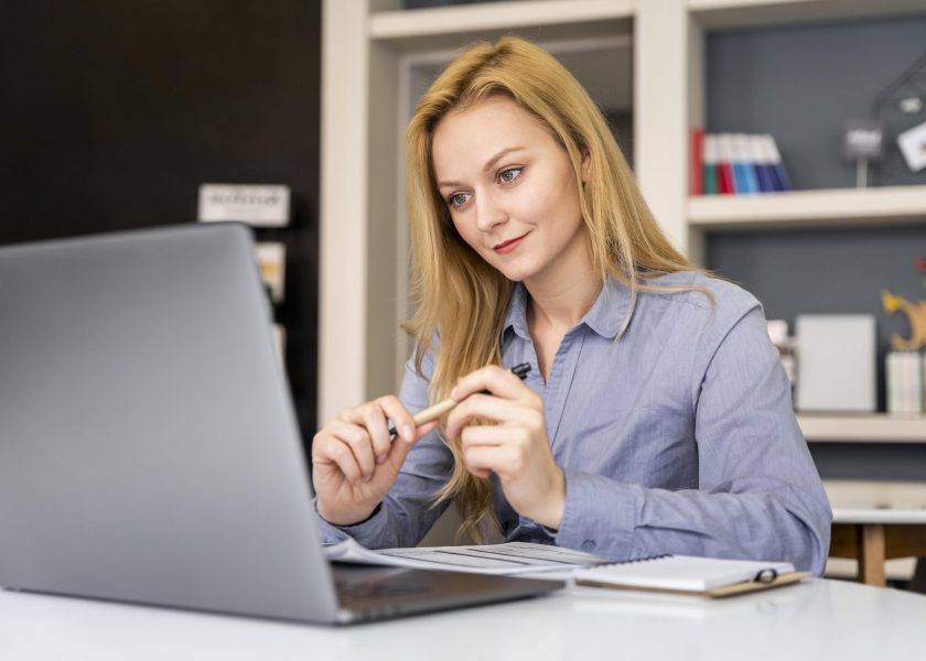 medium-shot-woman-working-with-laptop